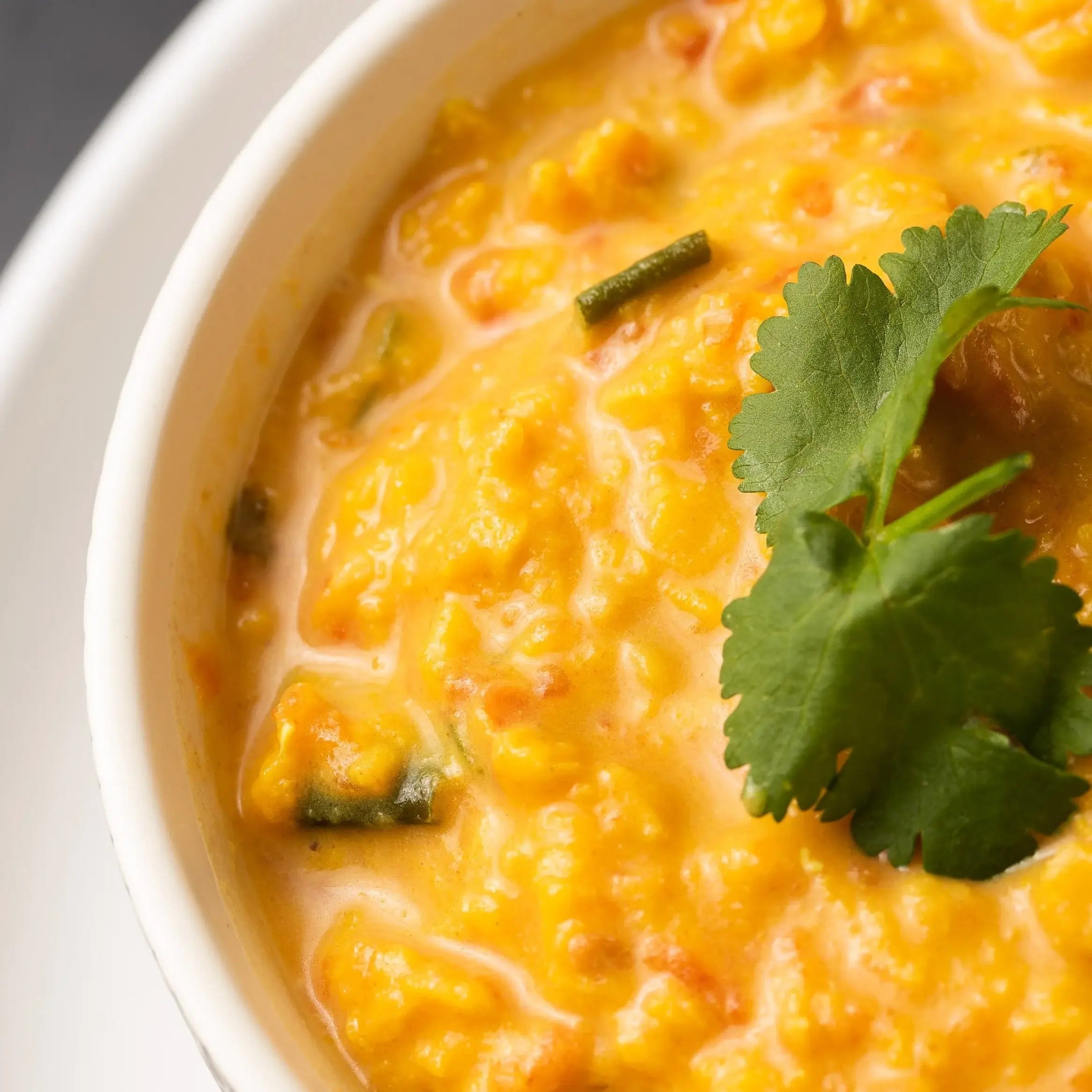 Bowl of orange soup or dhal.