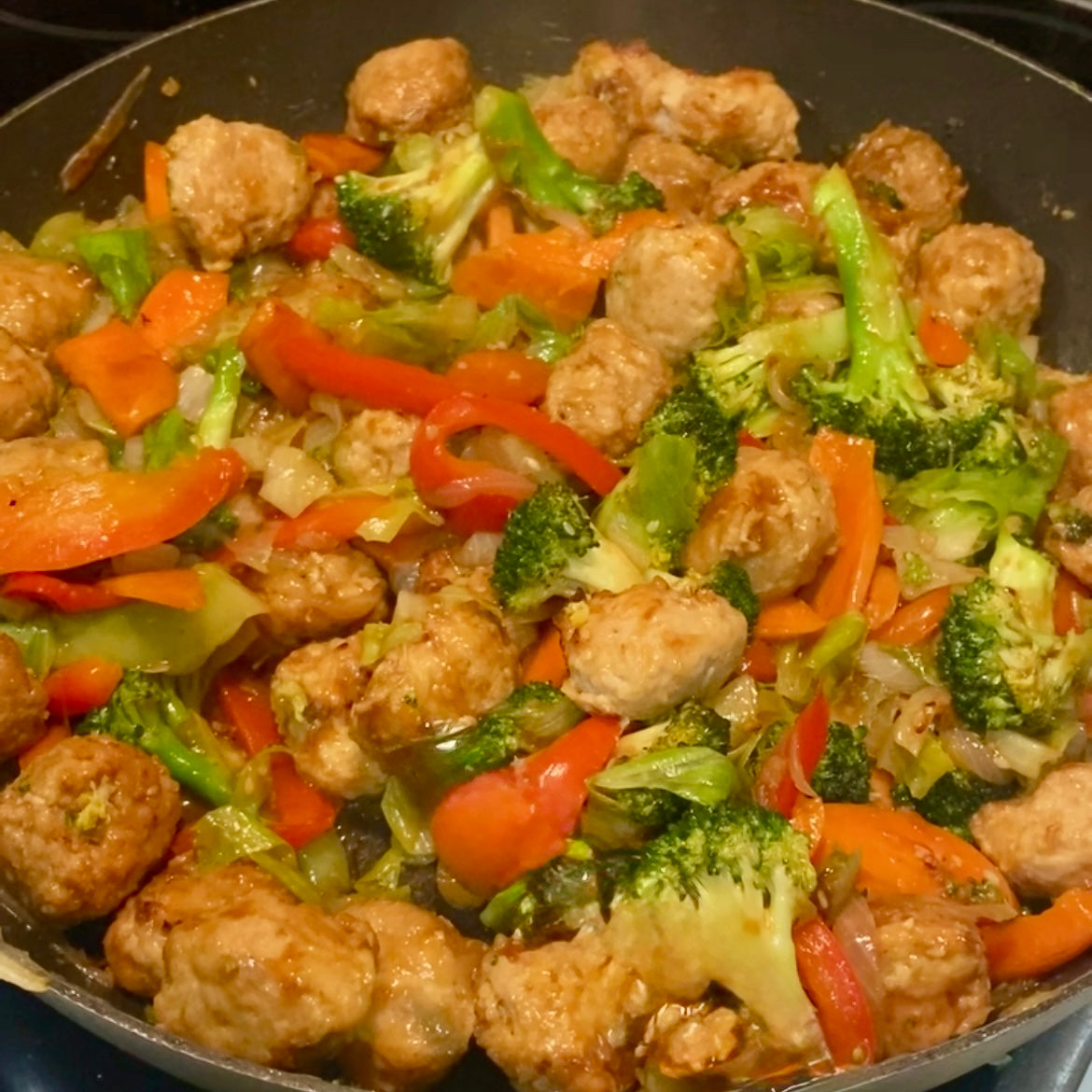 A fry pan full of Sesame Chicken Ball stir fry