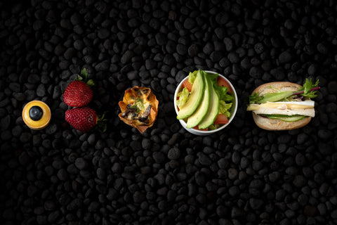 Food on black pebbles