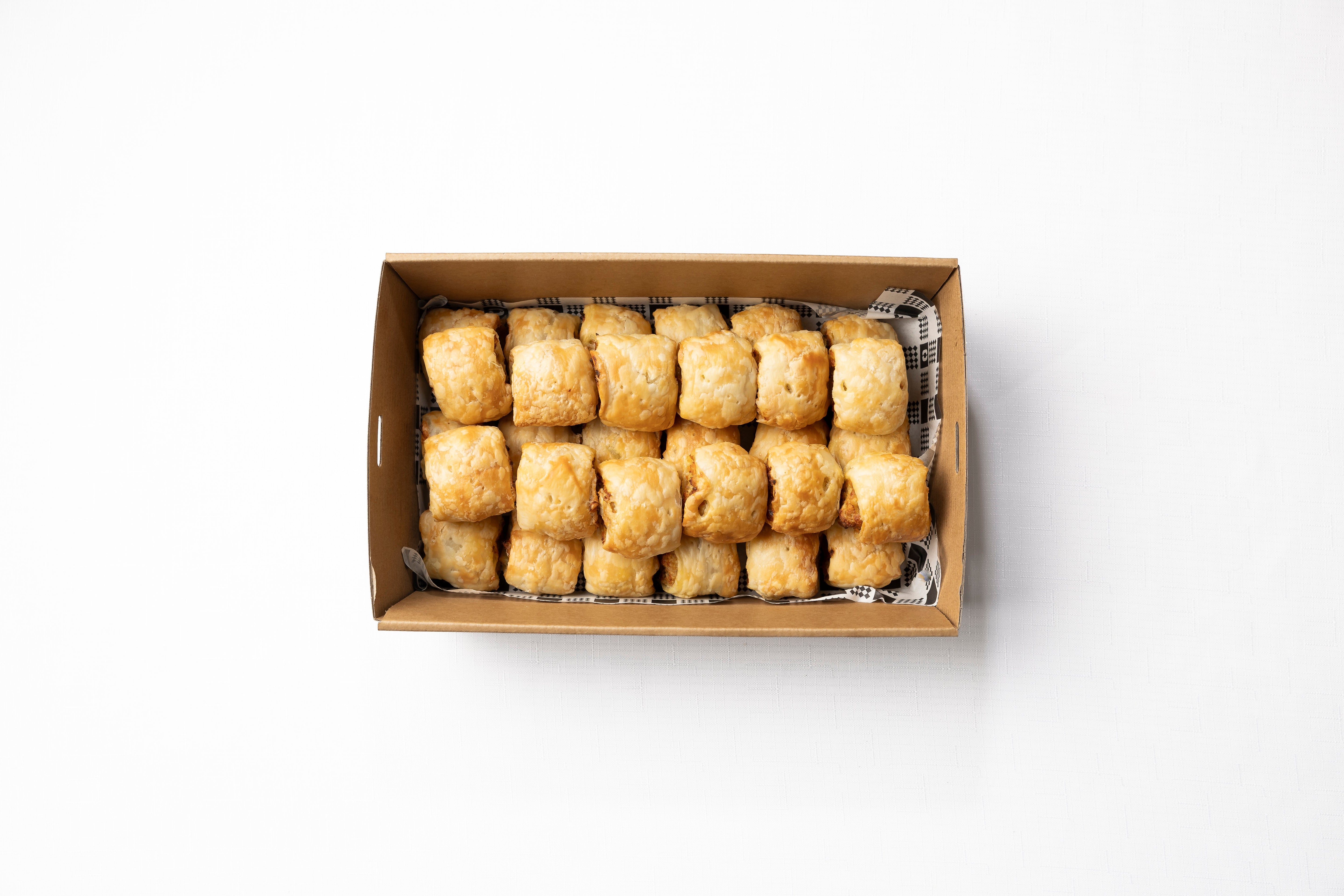 A box of 30 homemade cocktail sausage rolls