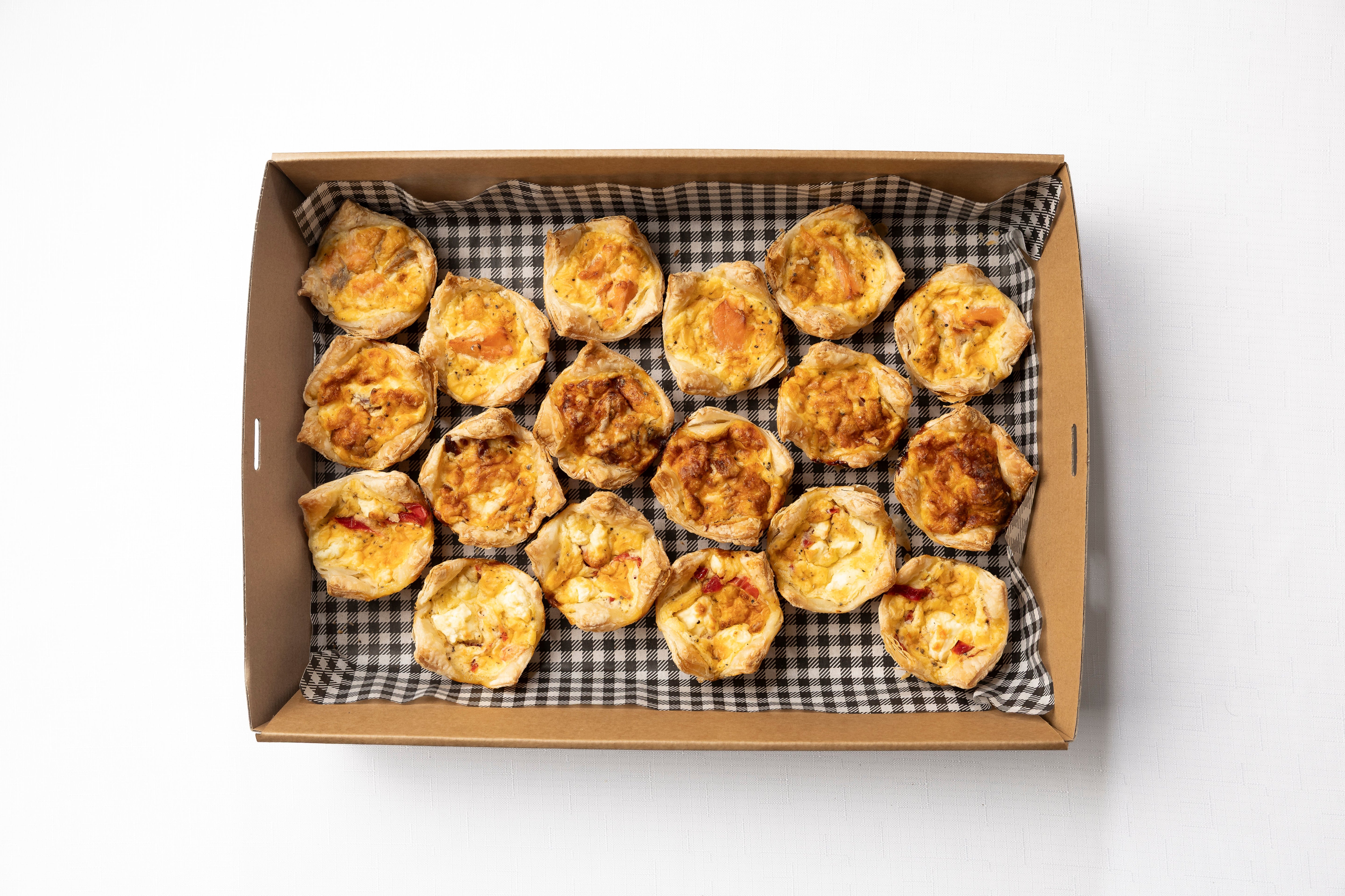A box of 18 freshly baked quiches