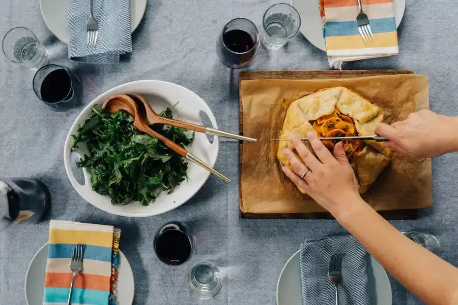 Dinner table with salad and galette