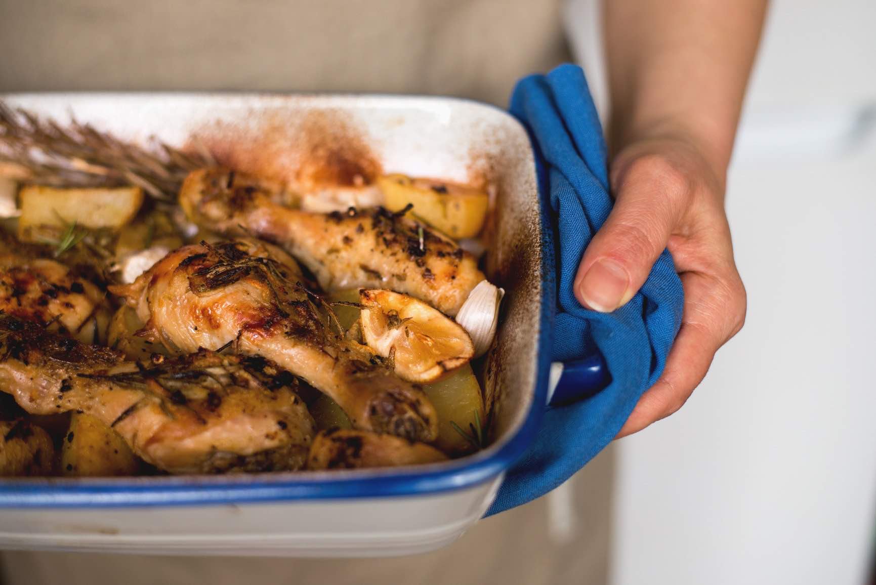 a sample catering photo of carrying roast chicken in a tray