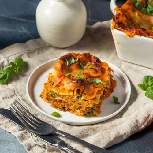 Vegetable lasagne sitting on a white plate